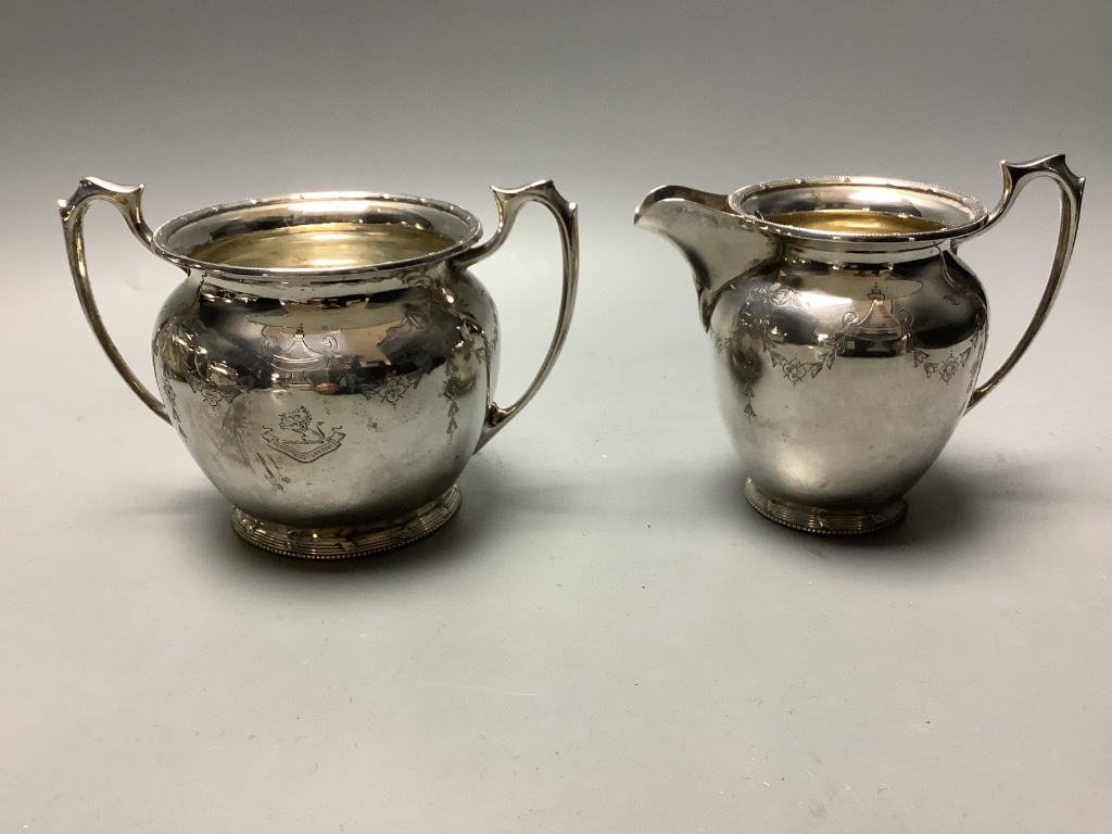 An Edwardian engraved silver four piece tea and coffee service